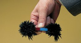 Iron powder on the poles of a bar magnet