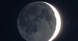 The darker side of the moon by light reflected off Earth