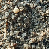 Sand viewed through magnifying glass