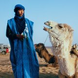A tuareg man with a camel