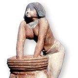 Statue of an Egyptian woman kneading the dough