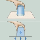 Why does the water stay inside the glass?