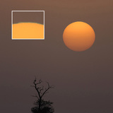 The colour of the rising sun's rim can become green due to atmospheric inversion