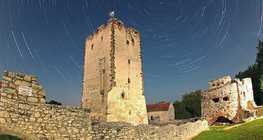 Star trails over a castle