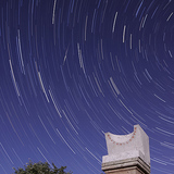 Star trails and a meteor over an ancient sundial