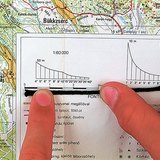 Measuring a string to determine the distance of a curved line on the map