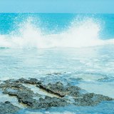 Waves breaking on rocks along the shore